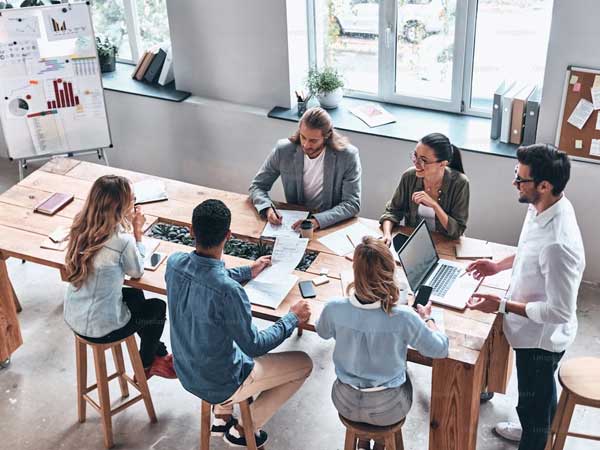 People sitting around a table during a strategic planning strategy session